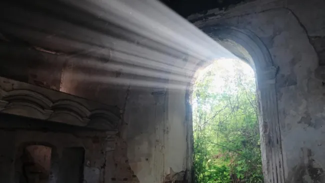 Sunlight shining into an old abandoned building